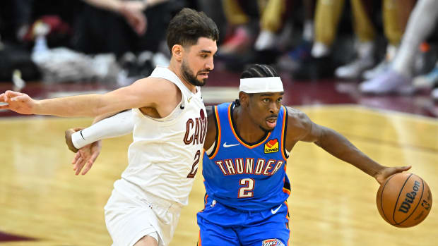 Oct 27, 2023; Cleveland, Ohio, USA; Cleveland Cavaliers guard Ty Jerome (2) defends Oklahoma City Thunder guard Shai Gilgeous-Alexander (2) in the second quarter at Rocket Mortgage FieldHouse.